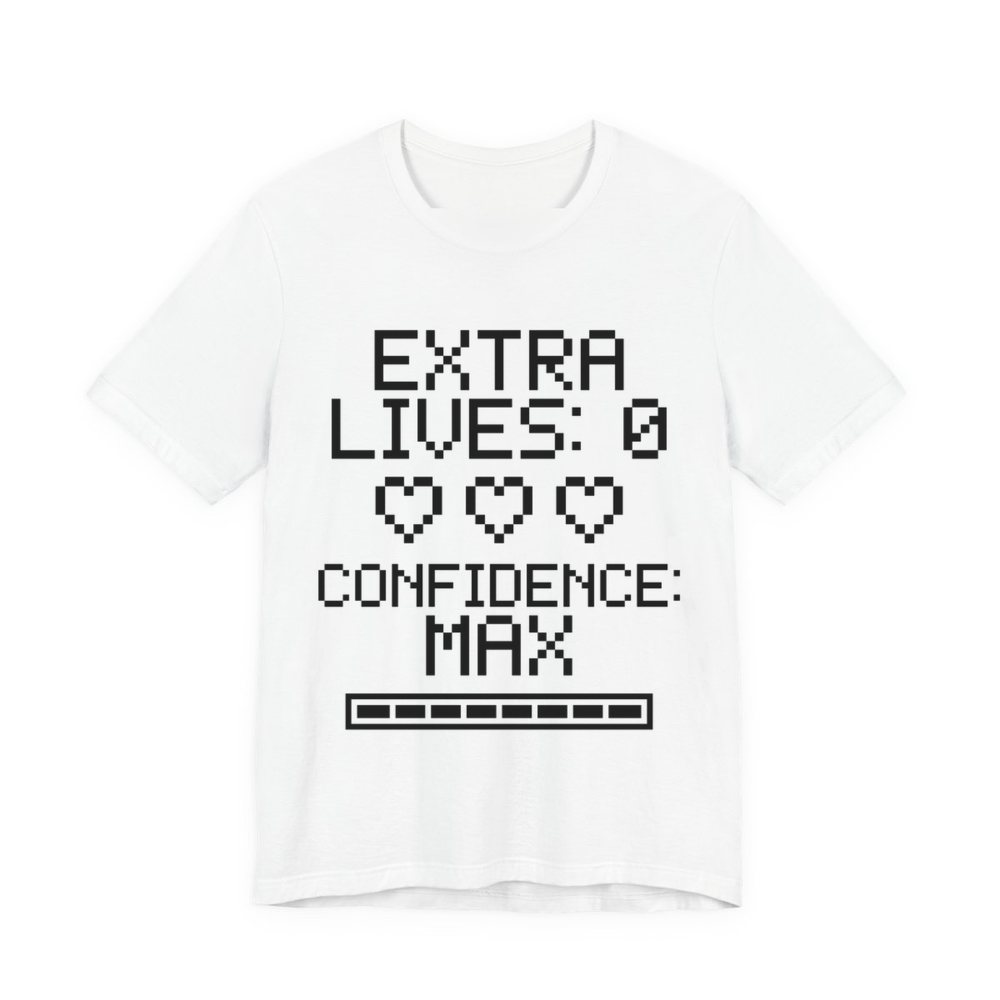 White t-shirt printed in dark ink with three empty pixel hearts, a full meter and the words “Extra Lives: 0. Confidence: Max.”