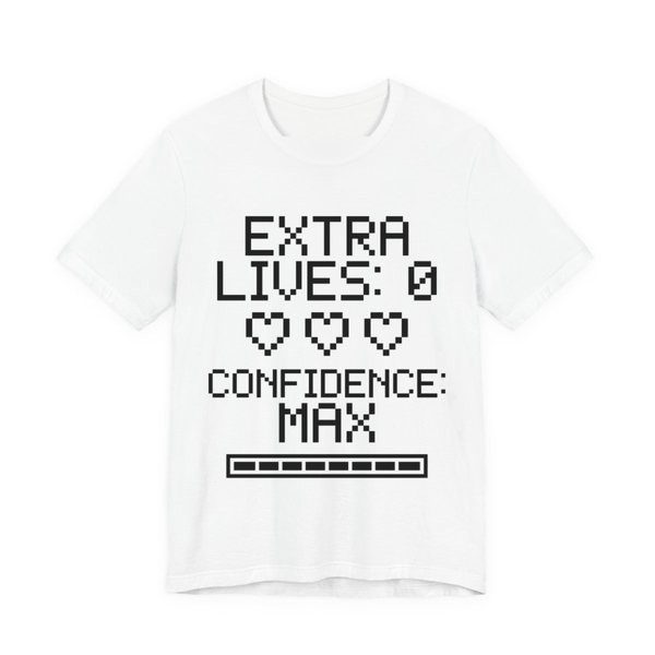 White t-shirt printed in dark ink with three empty pixel hearts, a full meter and the words “Extra Lives: 0. Confidence: Max.”