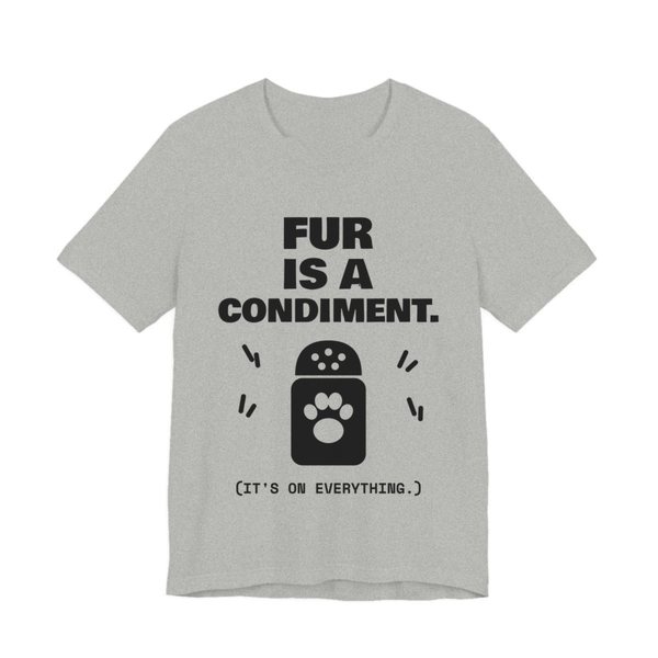 Athletic Heather t-shirt printed in dark ink with a shaker with a paw print and the words “Fur Is a Condiment. (It's on everything.)”