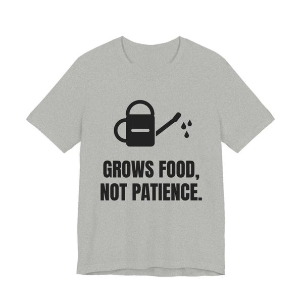 Athletic Heather t-shirt printed in dark ink with a watering can and the words “Grows Food, Not Patience.”