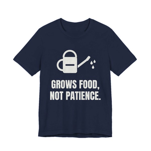 Navy t-shirt printed in off-white ink with a watering can and the words “Grows Food, Not Patience.”