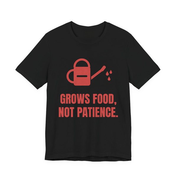 Black t-shirt printed in tomato red ink with a watering can and the words “Grows Food, Not Patience.”
