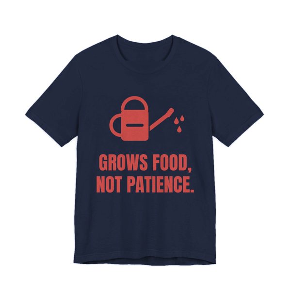 Navy t-shirt printed in tomato red ink with a watering can and the words “Grows Food, Not Patience.”