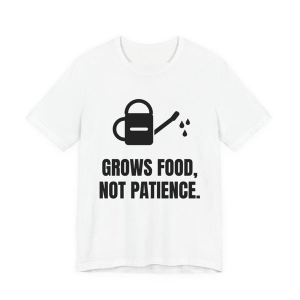 White t-shirt printed in dark ink with a watering can and the words “Grows Food, Not Patience.”