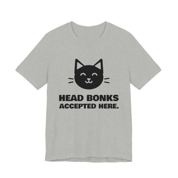 Athletic Heather t-shirt printed in dark ink with a cat face and the words “Head Bonks Accepted Here.”