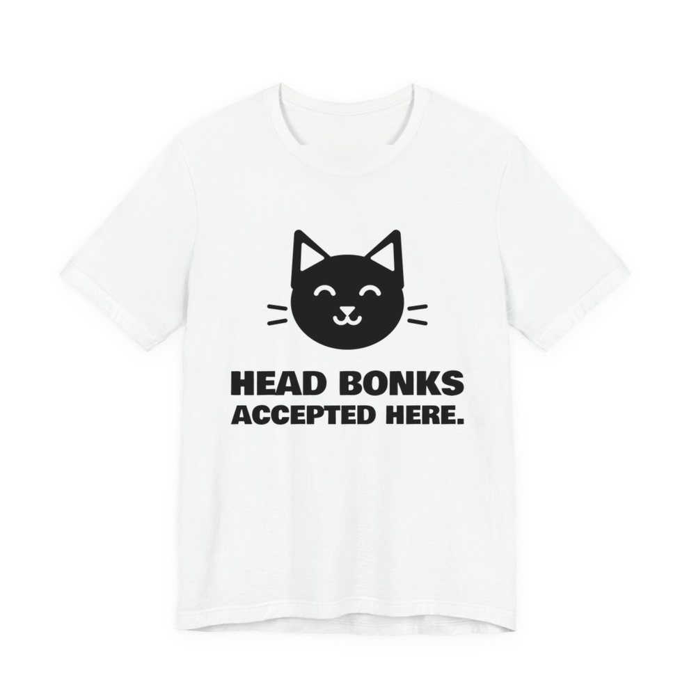 White t-shirt printed in dark ink with a cat face and the words “Head Bonks Accepted Here.”