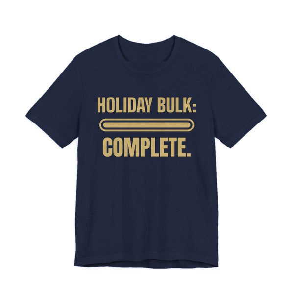 Navy t-shirt printed in champagne gold ink with a full progress bar and the words “Holiday Bulk: Complete.”