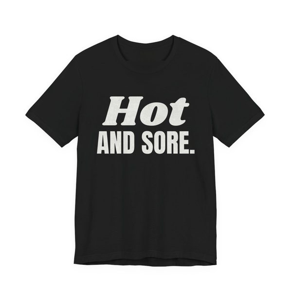 Black t-shirt printed in off-white ink with the words "Hot and Sore."