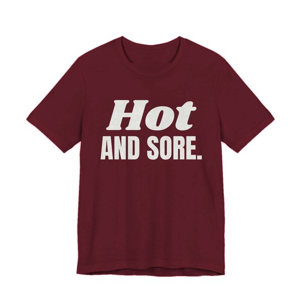 Maroon t-shirt printed in off-white ink with the words "Hot and Sore."