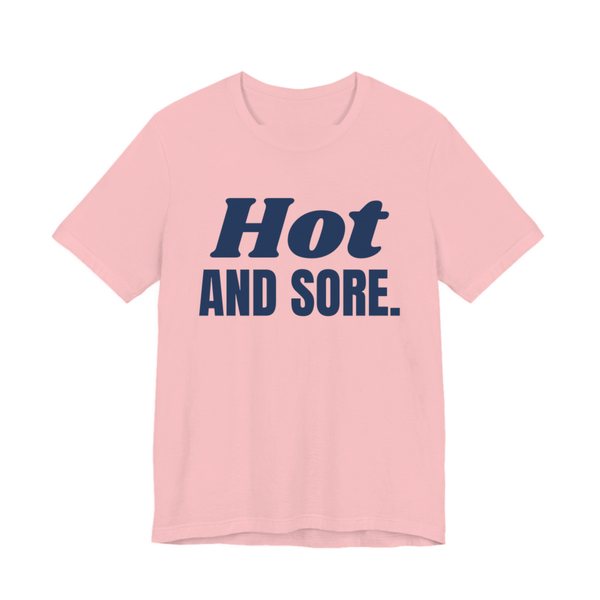Pink t-shirt printed in navy blue ink with the words "Hot and Sore."