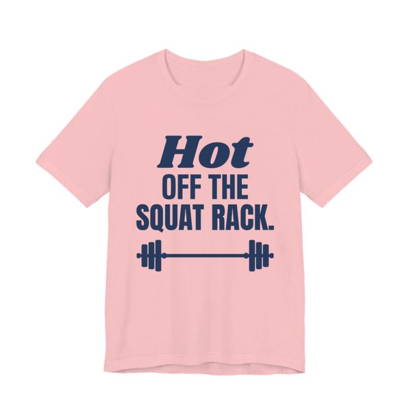 Pink t-shirt printed in navy blue ink with a barbell and the words "Hot Off the Squat Rack."