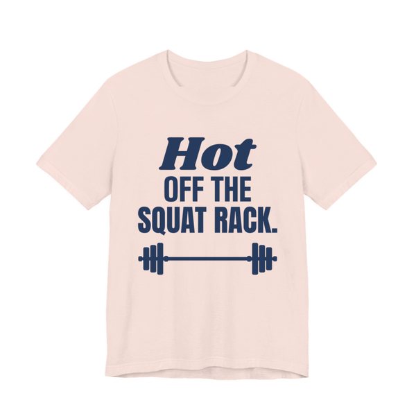 Soft Pink t-shirt printed in navy blue ink with a barbell and the words "Hot Off the Squat Rack."