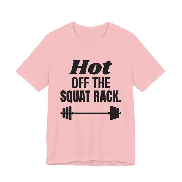 Pink t-shirt printed in dark ink with a barbell and the words "Hot Off the Squat Rack."