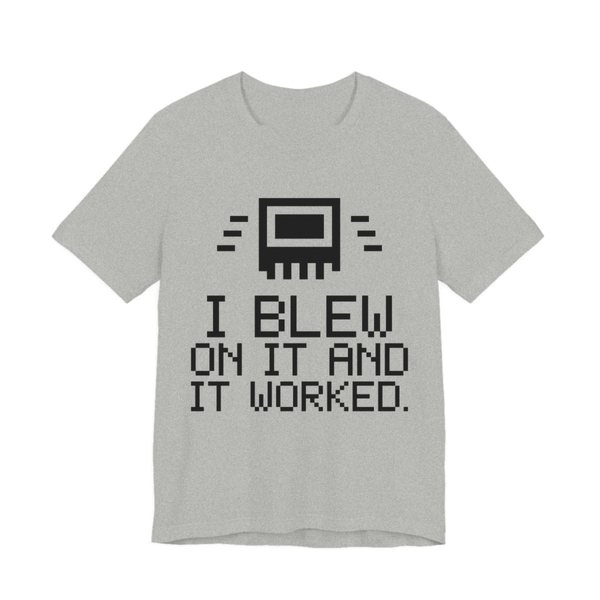 Athletic Heather t-shirt printed in dark ink with a pixel-art cartridge and the words “I Blew on It and It Worked.” in a blocky pixel font