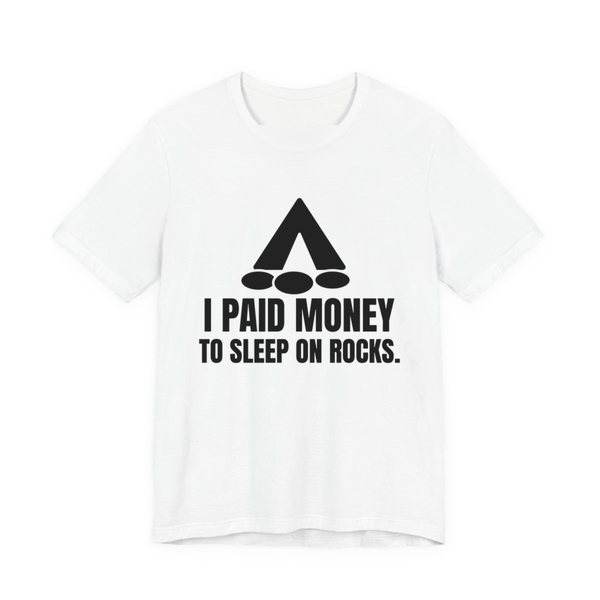 White t-shirt printed in dark ink with a tent, a pile of rocks and the words “I Paid Money to Sleep on Rocks.”