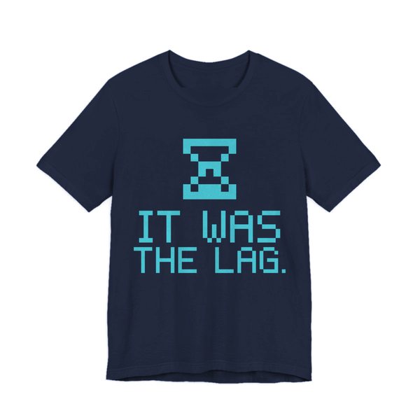 Navy t-shirt printed in cyan ink with a pixel hourglass and the words “It Was the Lag.”