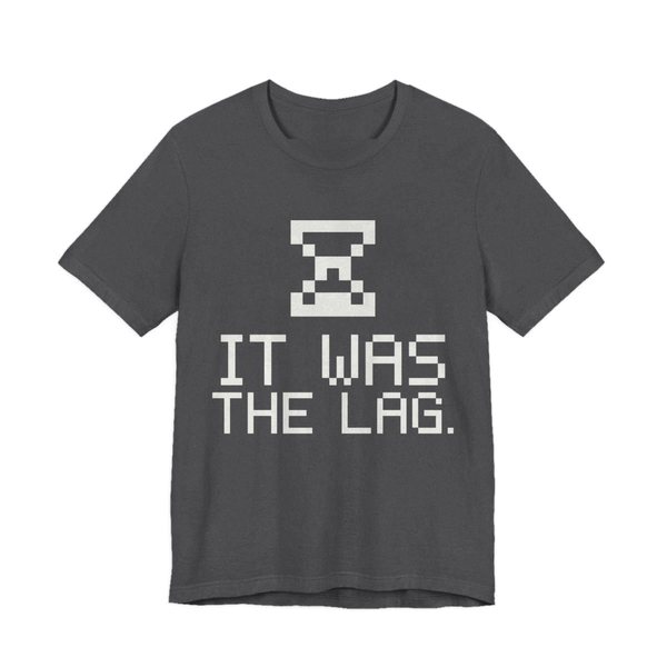 Dark Grey Heather t-shirt printed in off-white ink with a pixel hourglass and the words “It Was the Lag.”