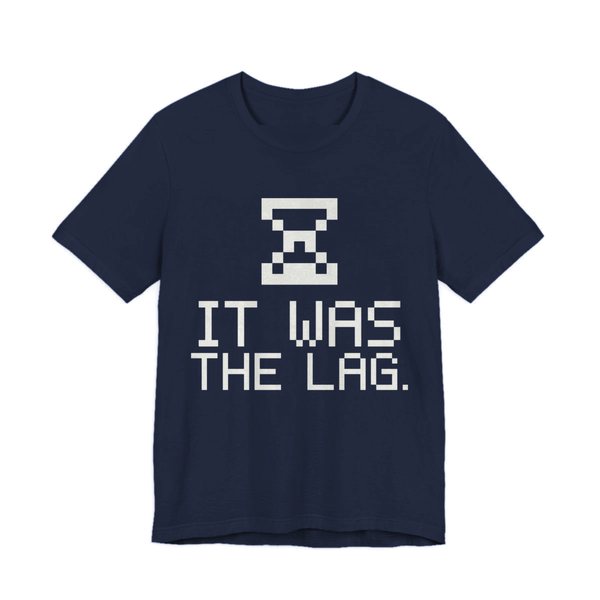 Navy t-shirt printed in off-white ink with a pixel hourglass and the words “It Was the Lag.”