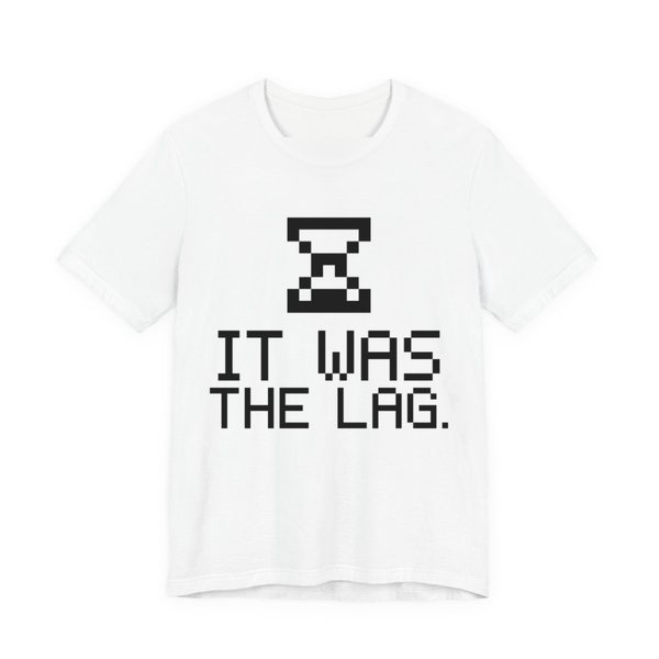 White t-shirt printed in dark ink with a pixel hourglass and the words “It Was the Lag.”
