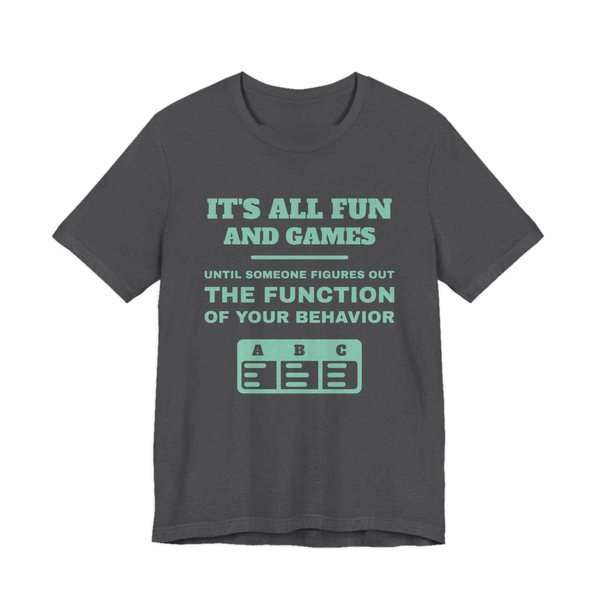 Dark Grey Heather t-shirt printed in chalk mint ink with an ABC data chart and the words “It's all fun and games until someone figures out the function of your behavior”