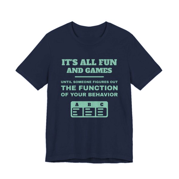 Navy t-shirt printed in chalk mint ink with an ABC data chart and the words “It's all fun and games until someone figures out the function of your behavior”