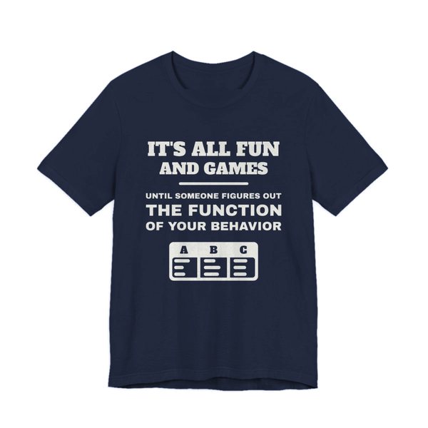 Navy t-shirt printed in off-white ink with an ABC data chart and the words “It's all fun and games until someone figures out the function of your behavior”