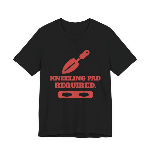 Black t-shirt printed in tomato red ink with a trowel, a kneeling pad and the words “Kneeling Pad Required.”