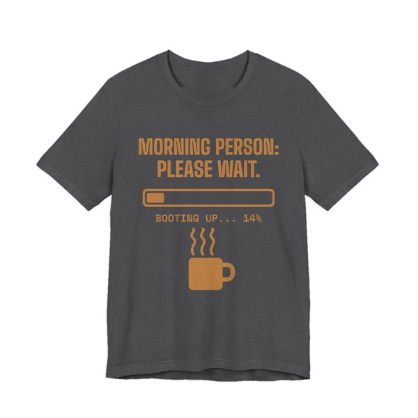 Dark Grey Heather t-shirt printed in caramel ink with a loading bar, a steaming mug and the words “Morning Person: Please Wait. Booting up... 14%”