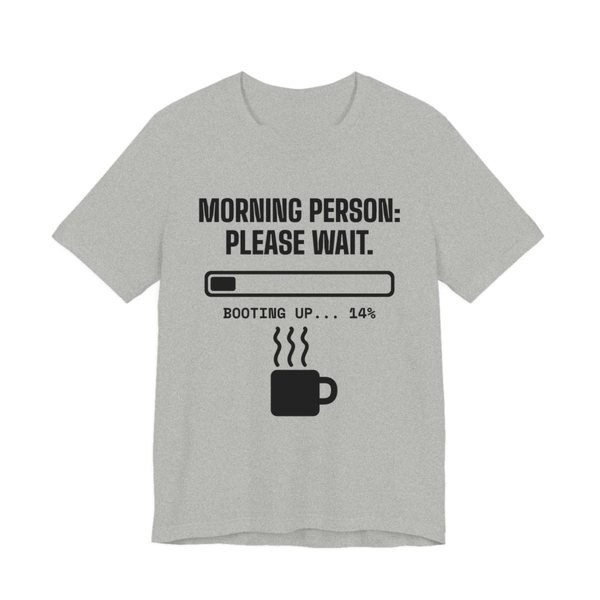 Athletic Heather t-shirt printed in dark ink with a loading bar, a steaming mug and the words “Morning Person: Please Wait. Booting up... 14%”