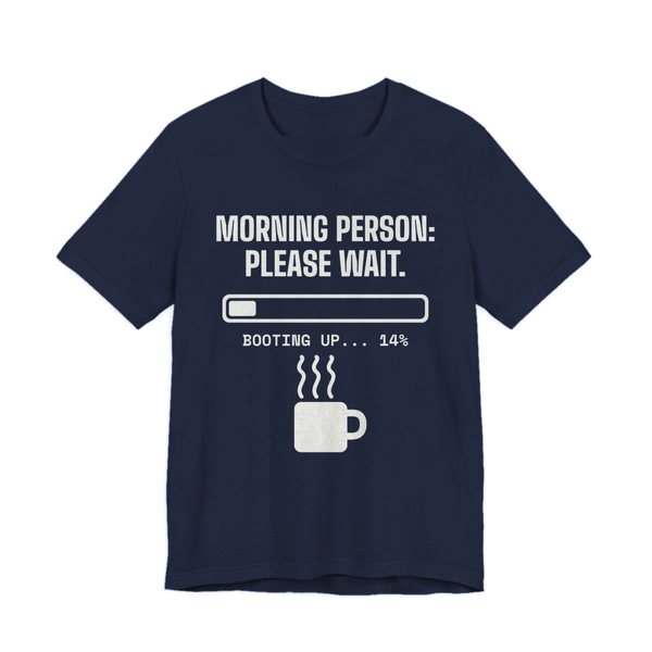 Navy t-shirt printed in off-white ink with a loading bar, a steaming mug and the words “Morning Person: Please Wait. Booting up... 14%”