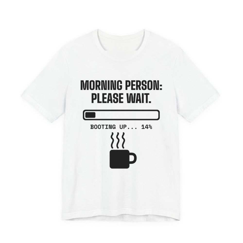 White t-shirt printed in dark ink with a loading bar, a steaming mug and the words “Morning Person: Please Wait. Booting up... 14%”