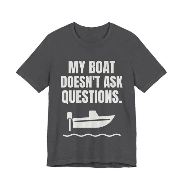 Dark Grey Heather t-shirt printed in off-white ink with a boat on the waves and the words “My Boat Doesn't Ask Questions.”