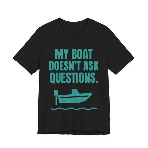Black t-shirt printed in teal ink with a boat on the waves and the words “My Boat Doesn't Ask Questions.”