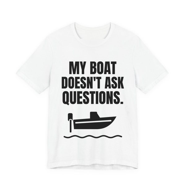 White t-shirt printed in dark ink with a boat on the waves and the words “My Boat Doesn't Ask Questions.”