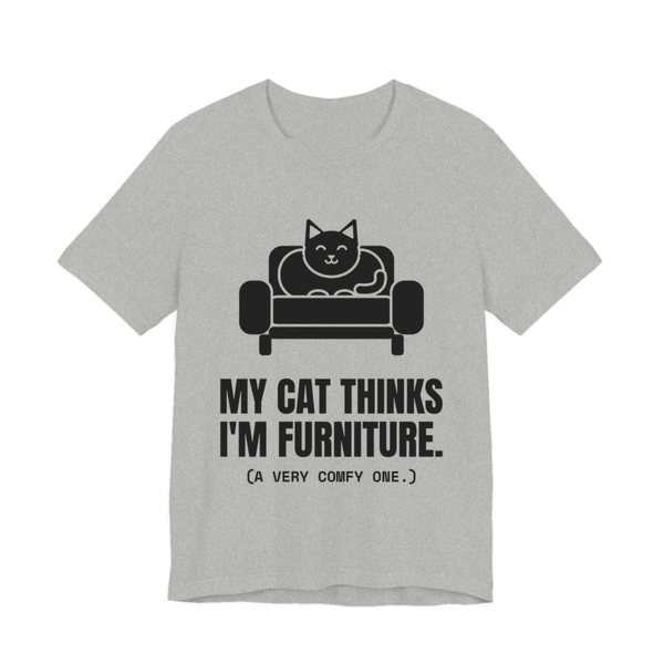 Athletic Heather t-shirt printed in dark ink with a cat on an armchair and the words “My Cat Thinks I'm Furniture.”