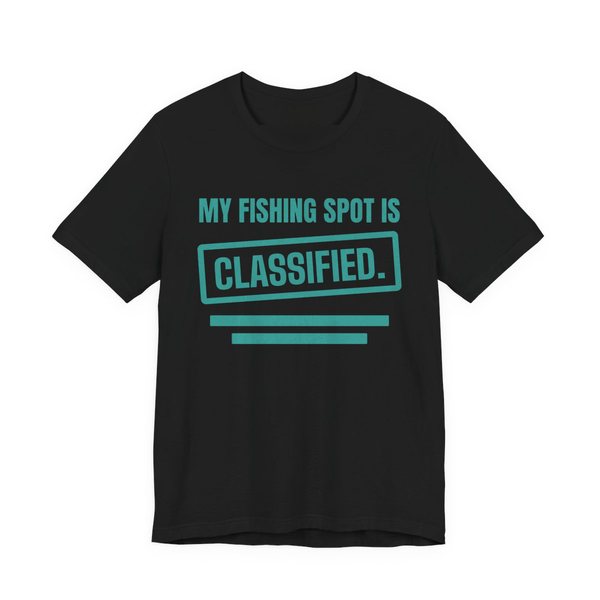 Black t-shirt printed in teal ink with a stamp box, redaction bars and the words “My Fishing Spot Is Classified.”