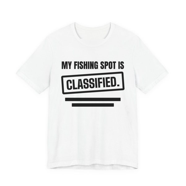 White t-shirt printed in dark ink with a stamp box, redaction bars and the words “My Fishing Spot Is Classified.”