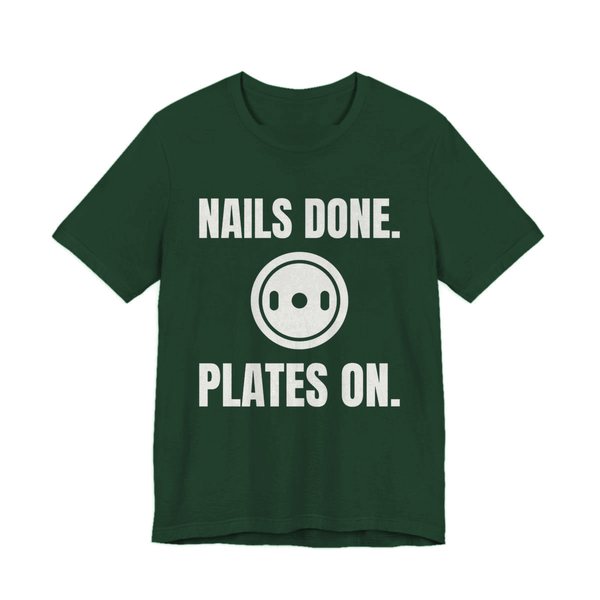 Forest t-shirt printed in off-white ink with a weight plate between the words "Nails Done." and "Plates On."
