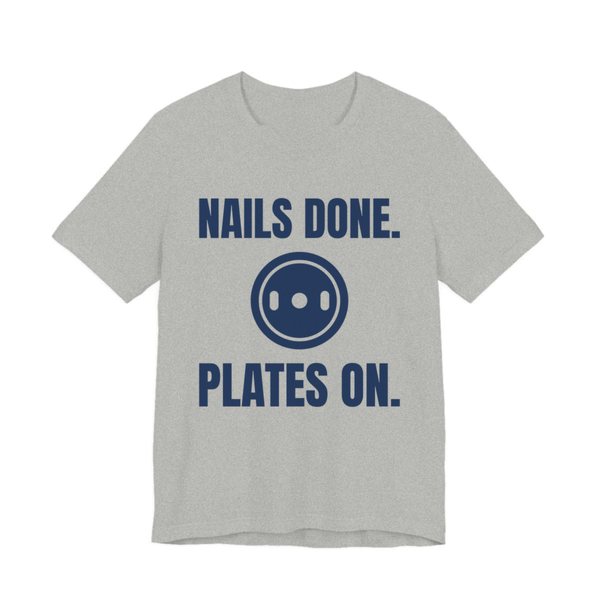 Athletic Heather t-shirt printed in navy blue ink with a weight plate between the words "Nails Done." and "Plates On."