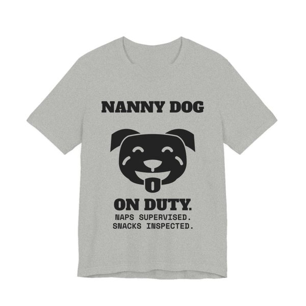 Athletic Heather t-shirt printed in dark ink with a smiling pit bull face and the words “Nanny Dog On Duty. Naps Supervised. Snacks Inspected.”