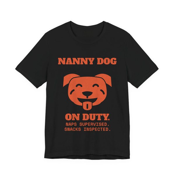 Black t-shirt printed in orange ink with a smiling pit bull face and the words “Nanny Dog On Duty. Naps Supervised. Snacks Inspected.”