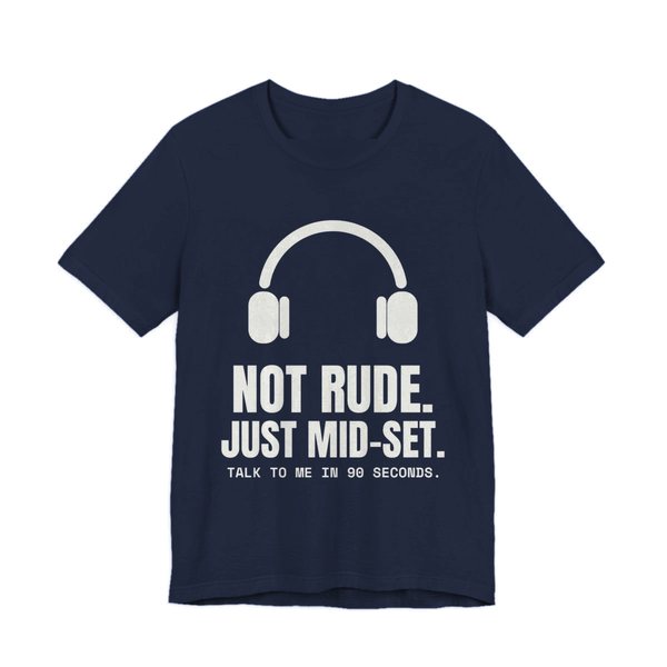 Navy t-shirt printed in off-white ink with a pair of headphones and the words “Not Rude. Just Mid-Set. Talk to me in 90 seconds.”