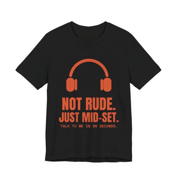 Black t-shirt printed in orange ink with a pair of headphones and the words “Not Rude. Just Mid-Set. Talk to me in 90 seconds.”