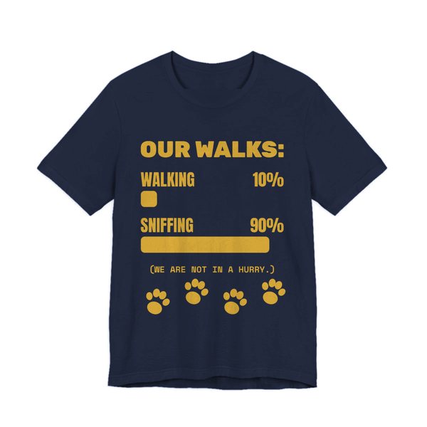 Navy t-shirt printed in gold ink with a bar chart of walking 10% and sniffing 90%, paw prints and the words “Our Walks.” (We are not in a hurry.)