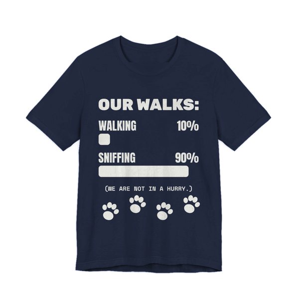 Navy t-shirt printed in off-white ink with a bar chart of walking 10% and sniffing 90%, paw prints and the words “Our Walks.” (We are not in a hurry.)