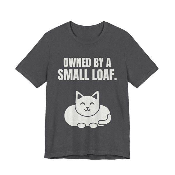 Dark Grey Heather t-shirt printed in off-white ink with a loaf-shaped cat and the words “Owned by a Small Loaf.”