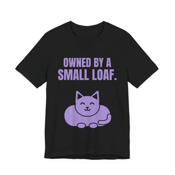 Black t-shirt printed in lavender ink with a loaf-shaped cat and the words “Owned by a Small Loaf.”