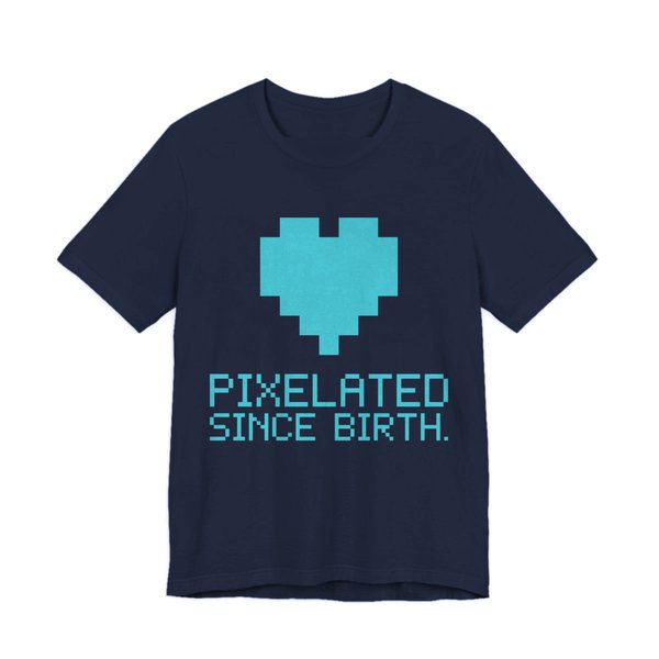 Navy t-shirt printed in cyan ink with a big pixel heart and the words “Pixelated Since Birth.”