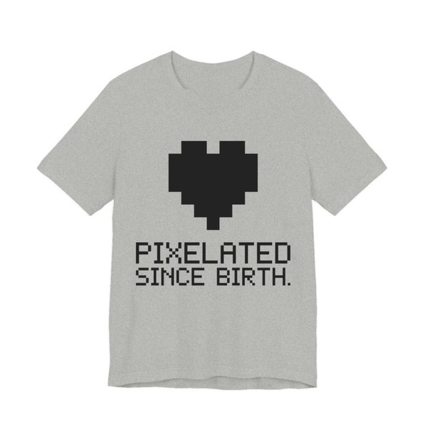 Athletic Heather t-shirt printed in dark ink with a big pixel heart and the words “Pixelated Since Birth.”