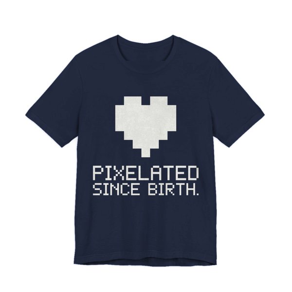 Navy t-shirt printed in off-white ink with a big pixel heart and the words “Pixelated Since Birth.”